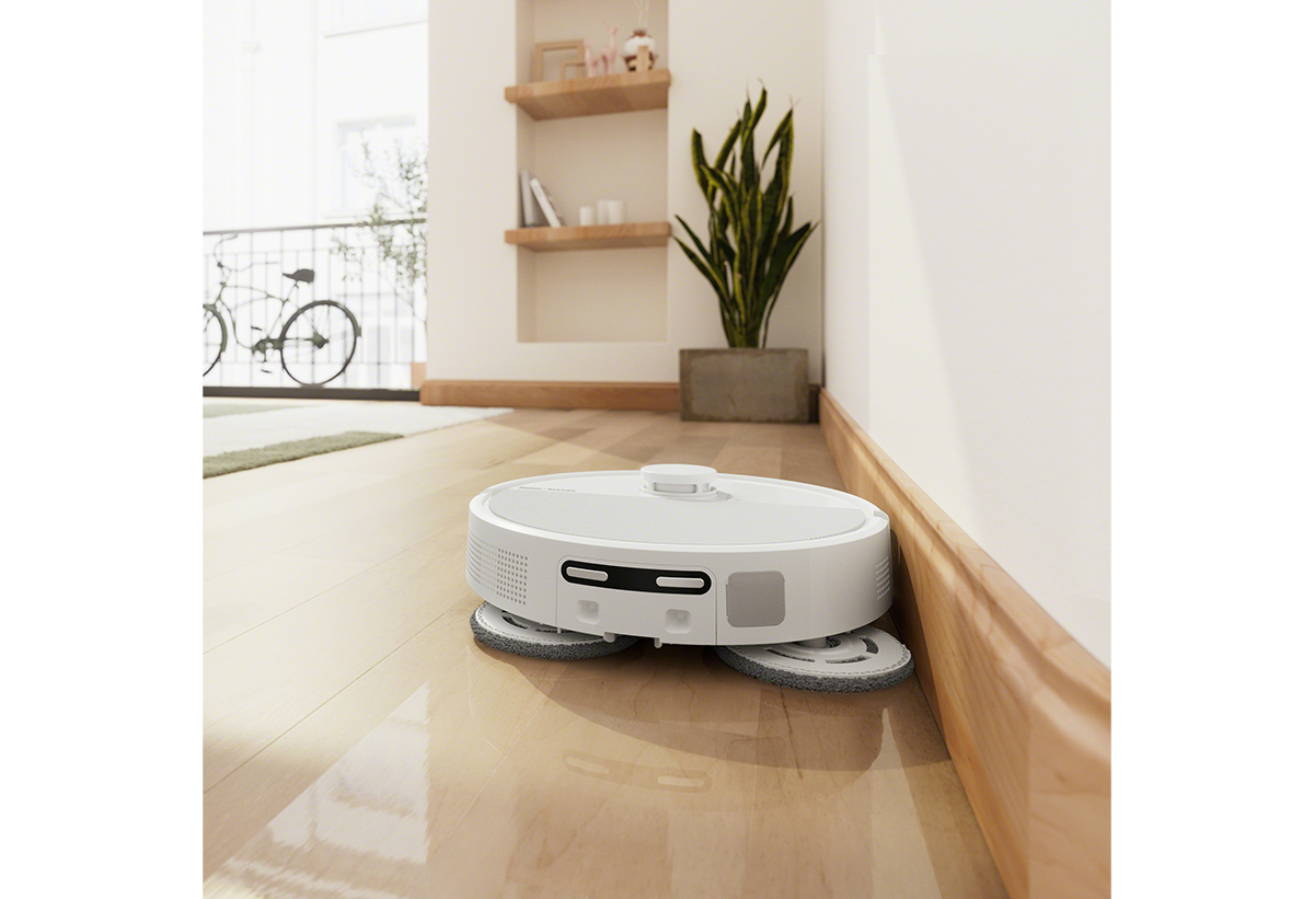 Απεικονίζεται η συσκευή στο πάτωμα ενός σαλονιού.